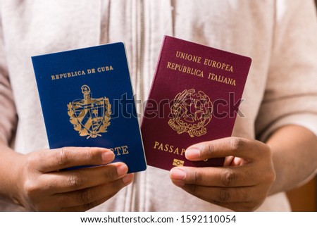 Woman with two passports. Cuban and Italian Royalty-Free Stock Photo #1592110054