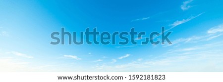 blue sky with white, soft clouds