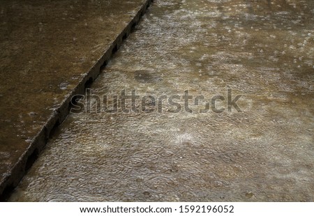 Splashing rainwater on the concrete floor when heavy rain