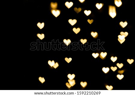Festive overlay effect. Golden heart bokeh festive glitter background. Christmas, New Year and Valentine's day design