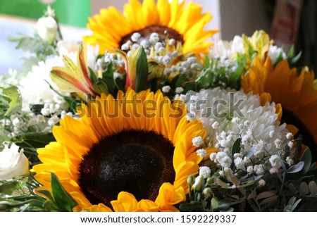 Bouquet of white chrysanthemums and yellow sunflowers