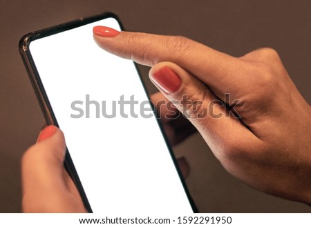 phone with a blank screen in female hands
