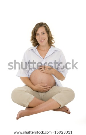 Caucasian woman who is 9 months pregnant on white background