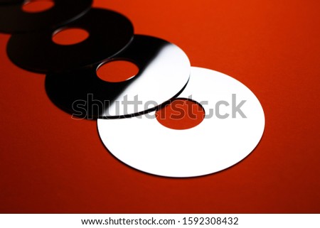 mirror discs on a red background
