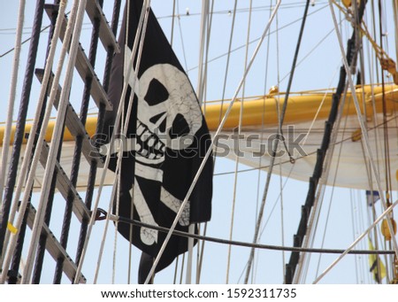 Staten Island, NY/USA - May 28, 2012: Rigging and the Jolly Roger flag of Indonesian Navy tall ship DEWARUCI, NY Fleet Week 2012
