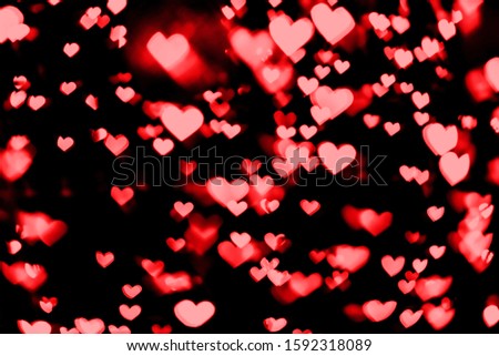 Festive overlay effect. Red and pink heart bokeh festive glitter background. Christmas, New Year and Valentine's day design