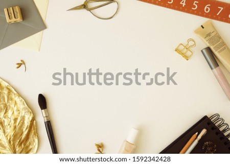 Elegant stationery flat lay composition. Stylish girl boss still life desk top view. Modern stock photo with copy space for bloggers or designers. Minimalist concept office workspace. Gold leaf.