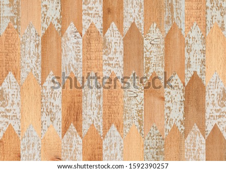 Light spruce wooden wall with geometric pattern. 