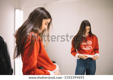 Young girl dress up a new Christmas sweater