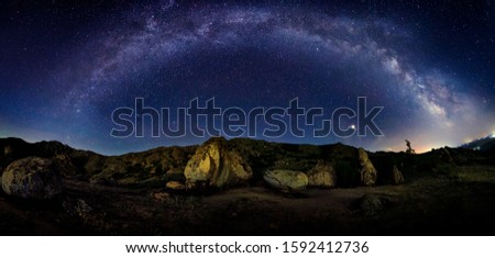 Night landscape with the Milky Way above old mountains of  Dobrogea, Romania