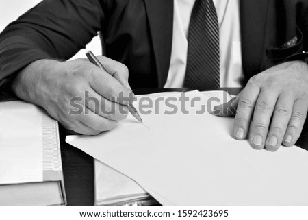 Men's hands sign documents of contracts, business, success, prosperity, power