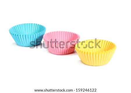 three cupcake holders pastel colored