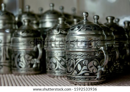 handcrafted silver turkish coffee set on kitchen shelf