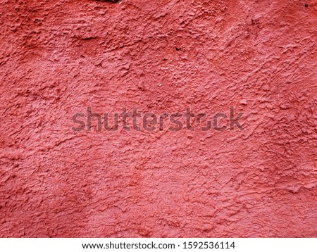 Wall. Red color. Texture. Close-up.