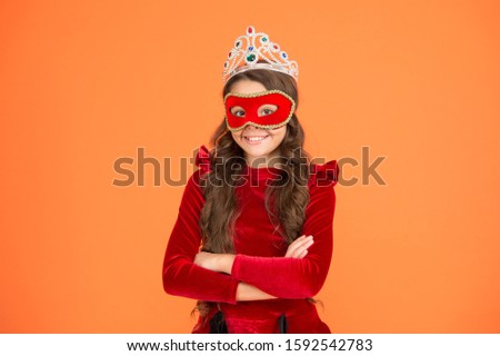 Royal and luxury. Visit royal public event anonymously. Winter new year party. Winter carnival. Incognito mode. Girl wear mask crown orange background. Royal event and entertainment. Princess award.