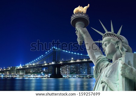 Manhattan Bridge and The Statue of Liberty at Night, New York City