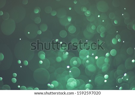 Abstract bokeh lights with light green background, beautiful bokeh from water droplets
