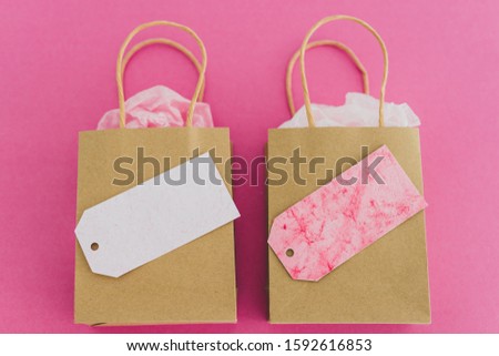 similar or alternative products conceptual still-life, shopping bags side by side with similar price tags and color
