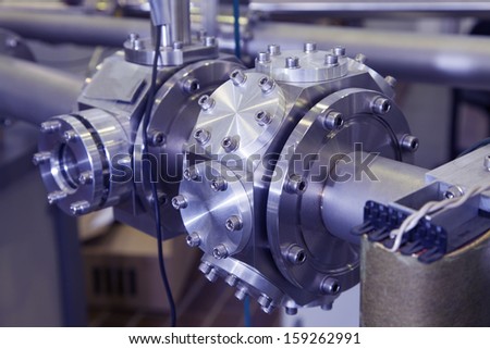 View of Important electronic and mechanical parts in ION Accelerator command room, CNC machined parts, selective focus, industrial blue toned   Royalty-Free Stock Photo #159262991