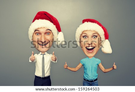 funny christmas picture of happy bighead couple over grey background