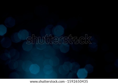 bright blurred abstract blue bokeh  on dark bacground for backdrop