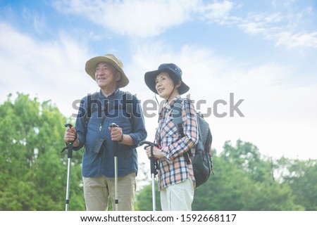 Senior couple walking in the mountains