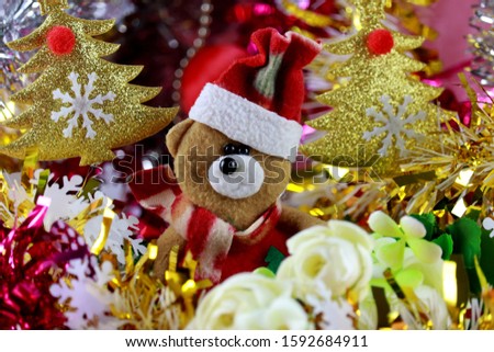 Teddy bear with santa hat in christmas background, Christmas and happy new year theme and pattern, Time for celebrate.