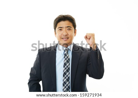 The male office worker who poses happily