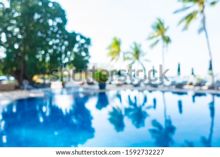 Abstract blur outdoor swimming pool in hotel resort for background