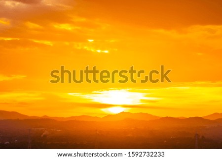 Beautiful outdoor landscape with sunrise or sunset over mountain