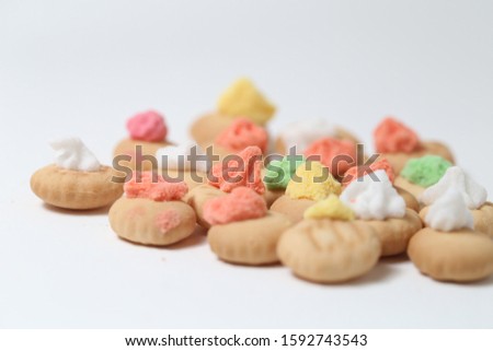 Belly button iced gem biscuits on white background