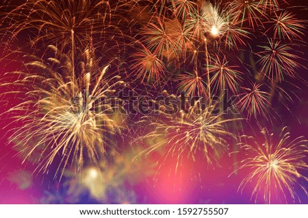 Closed-up of fireworks background with gold fireworks on twilight background.