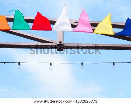 Colorful flags and light bulbs in sky, beautiful background wallpaper.