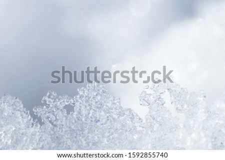 White winter snowflakes and ice close up texture pattern for designer screensaver background