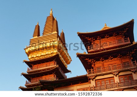 Golden Temples Roof Top Jing An Tranquility Temple Shanghai China with blue sky background, Richest buddhist temple in Shanghai.