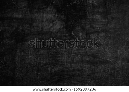 Abstract Dirty Black Chalkboard Background.