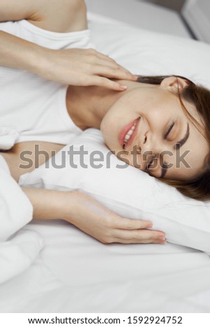 Woman sleeping in bed on a pillow close-up