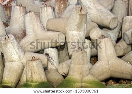 concrete tetrapods (traveling-wave protection) - background for port builders Royalty-Free Stock Photo #1593000961