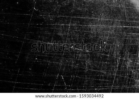 white scratches on a black background. texture for design
