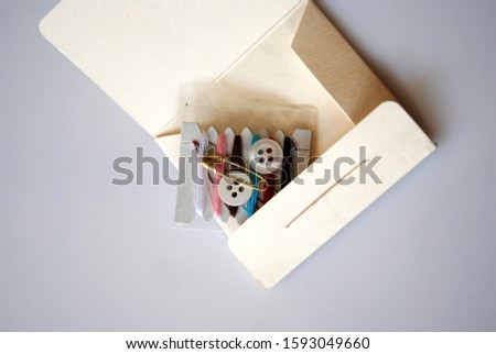 Sewing Kit for first Aid on grey background Royalty-Free Stock Photo #1593049660