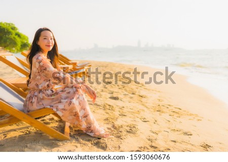 Portrait beautiful young asian women happy smile around outdoorn happy smile relax around tropical nature beach sea with palm tree