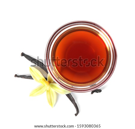 Vanilla extract, flower and dry pods isolated on white, top view Royalty-Free Stock Photo #1593080365