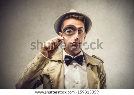 investigator looking with magnifying glass Royalty-Free Stock Photo #159315359