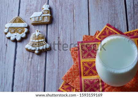 Delicious homemade Christmas gingerbread with milk on the table
