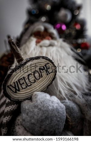 Santa Claus with a welcome sign