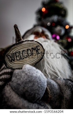 Santa Claus with a welcome sign