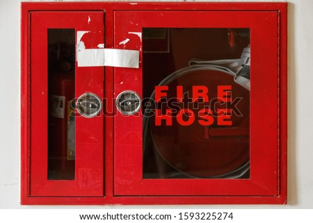 fire extinguisher box isolated on white background with the inscription " fire hose "