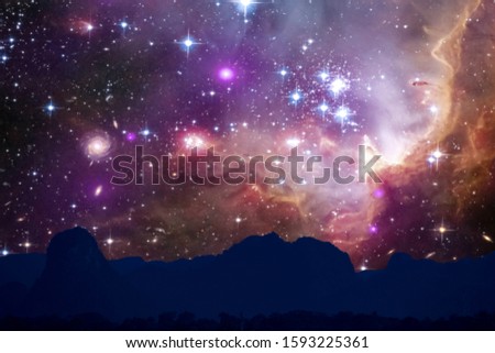 nebula and galaxy on space back on silhouette mountain hill and night sky, Elements of this image furnished by NASA