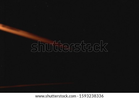 Old black abstract background. Texture. Lens flare and heavy grain.