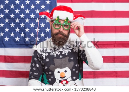 New year tradition in America. Bearded man on american flag. Celebrate xmas and new year in patriotic way. Festive tradition from USA. Respect american tradition. My freedom my tradition.